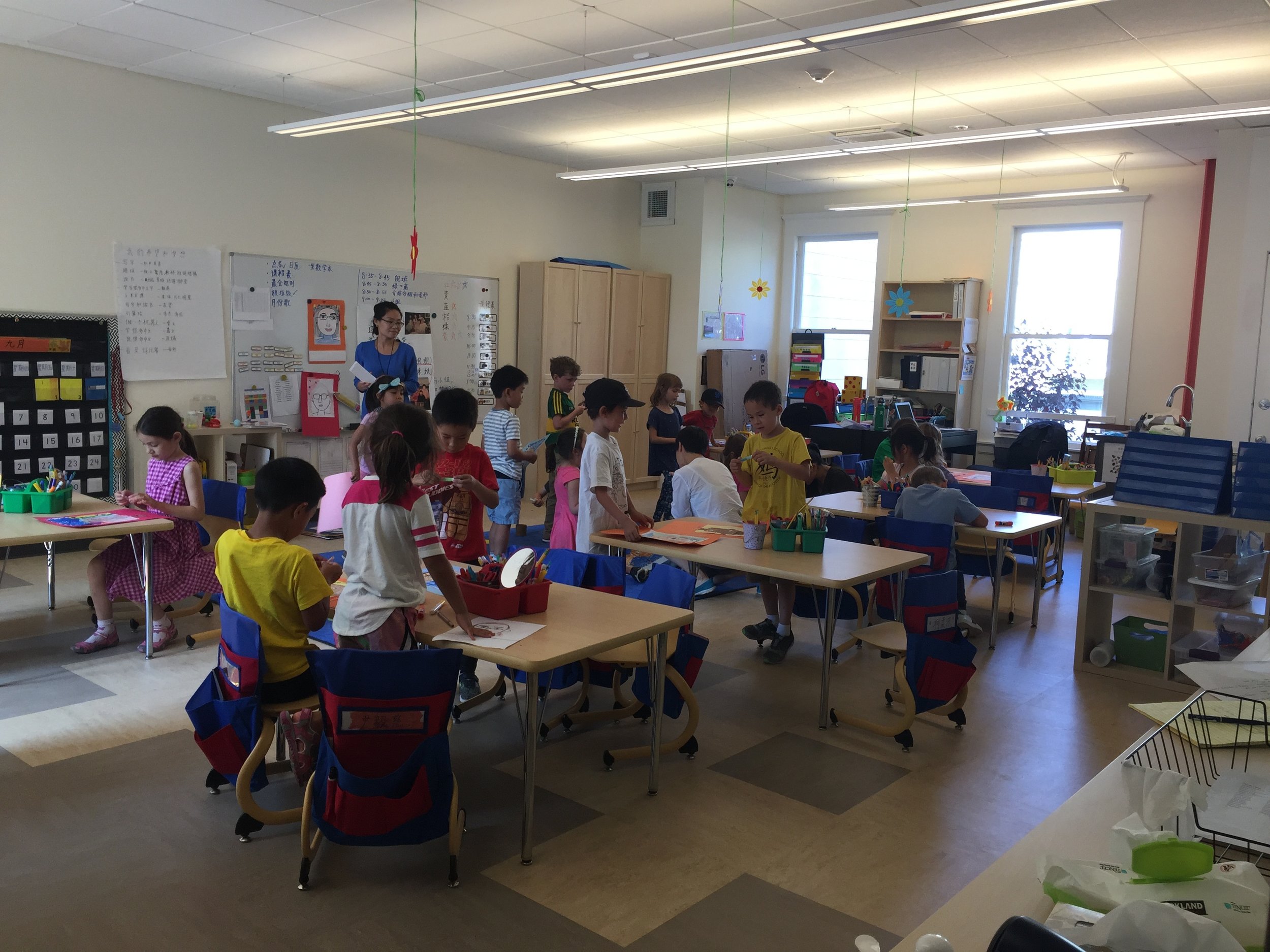  First graders hard at work in their new space. 