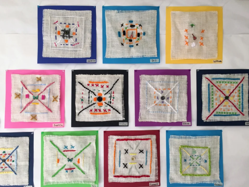 Artistic Explorations in 3rd Grade: Symmetrical Stitched Designs