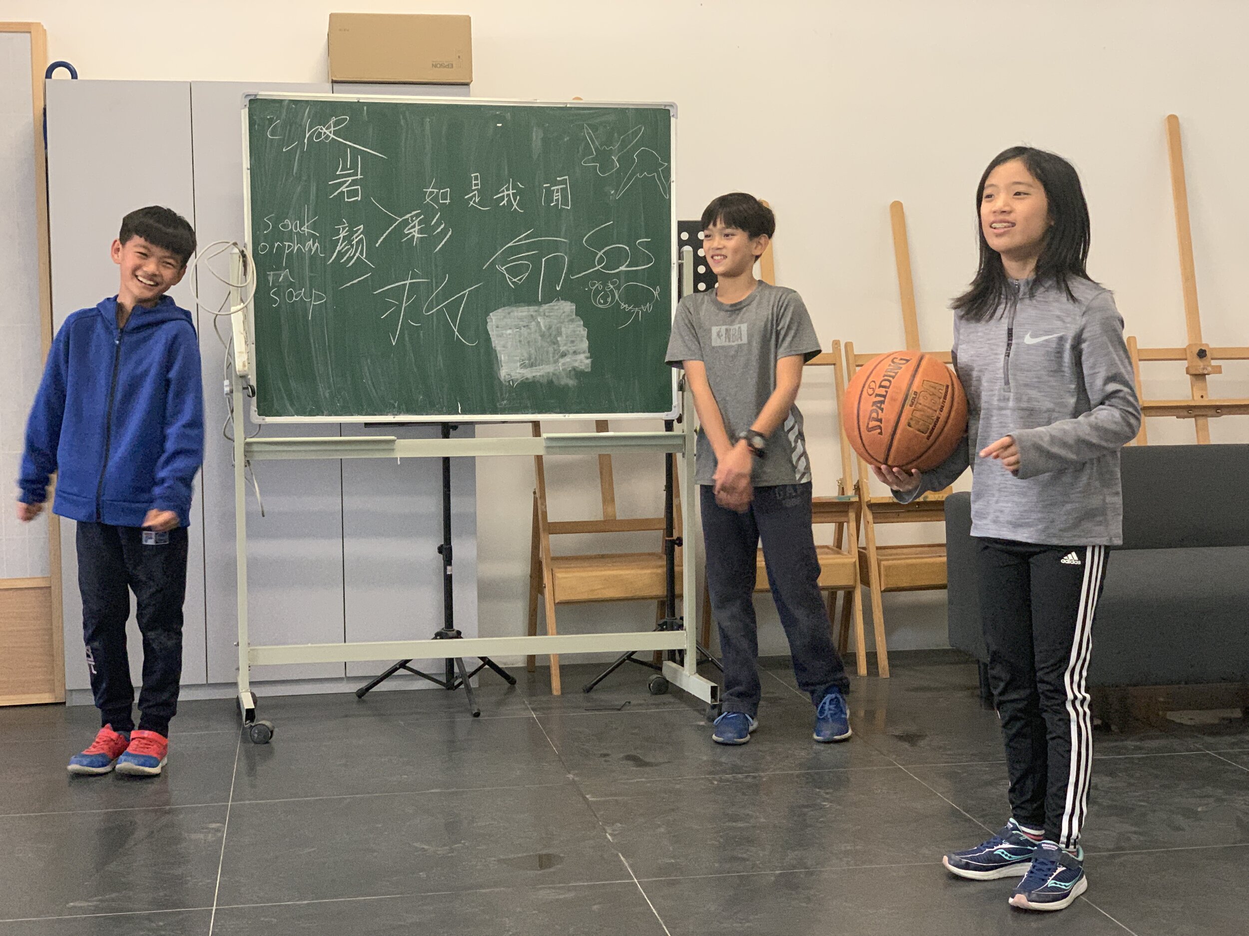   PKS and Rin Rin Xin students act out a scene from one of the family stories.  