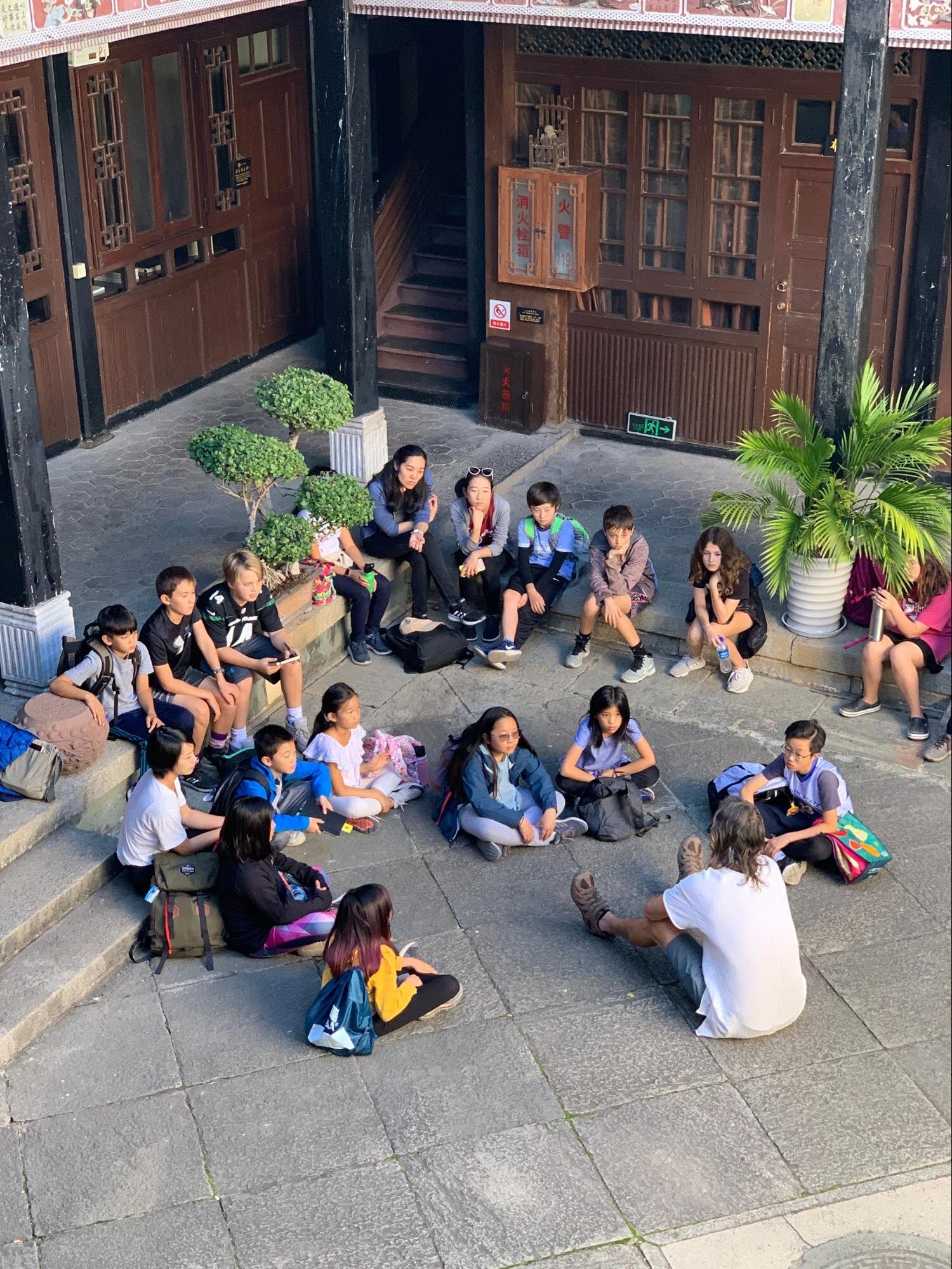 Brian speaks to our students in the courtyard.