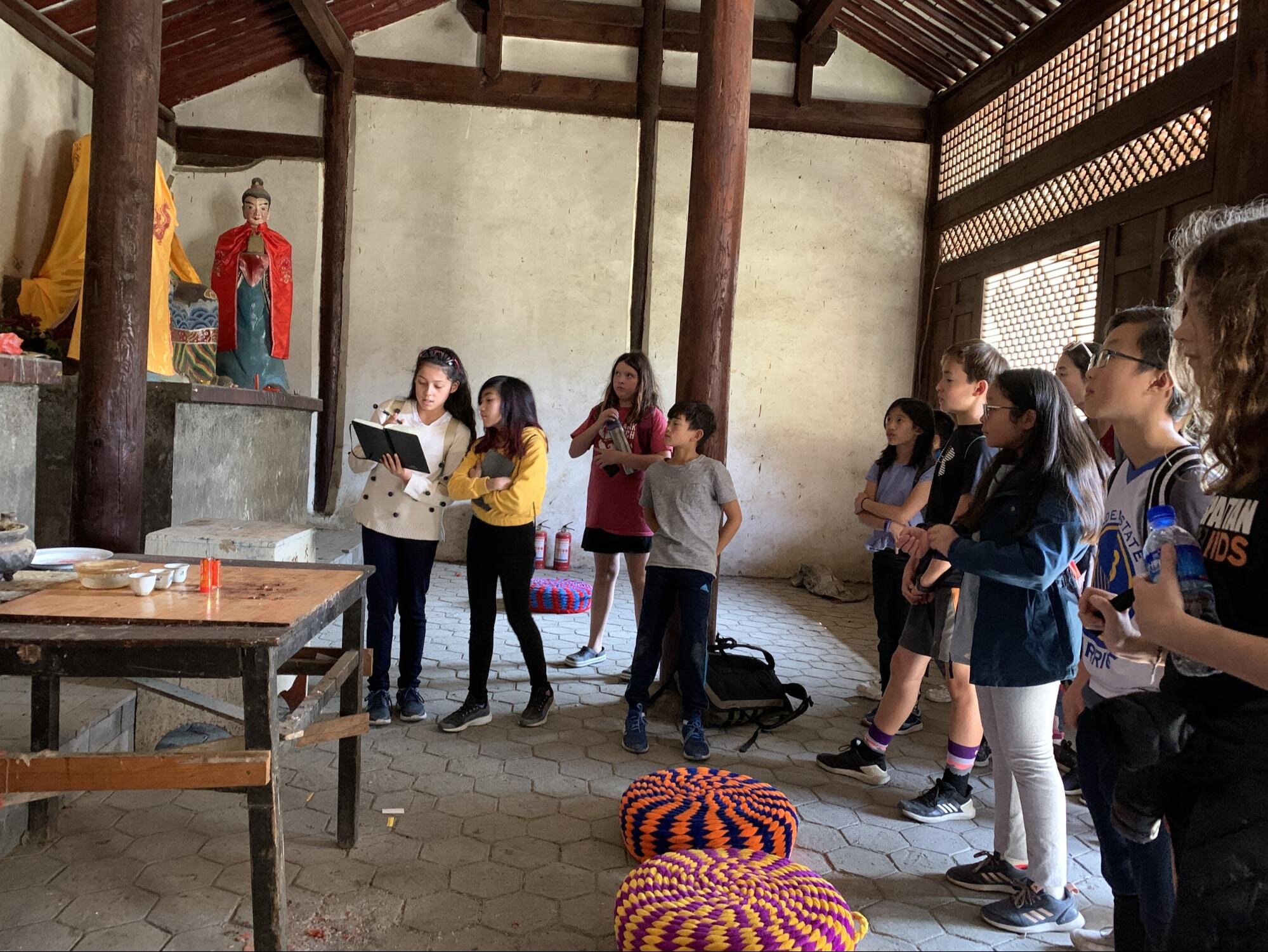 Three students teach about their temple.
